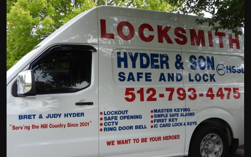 Close-up of the Hyder & Son van signage and services list