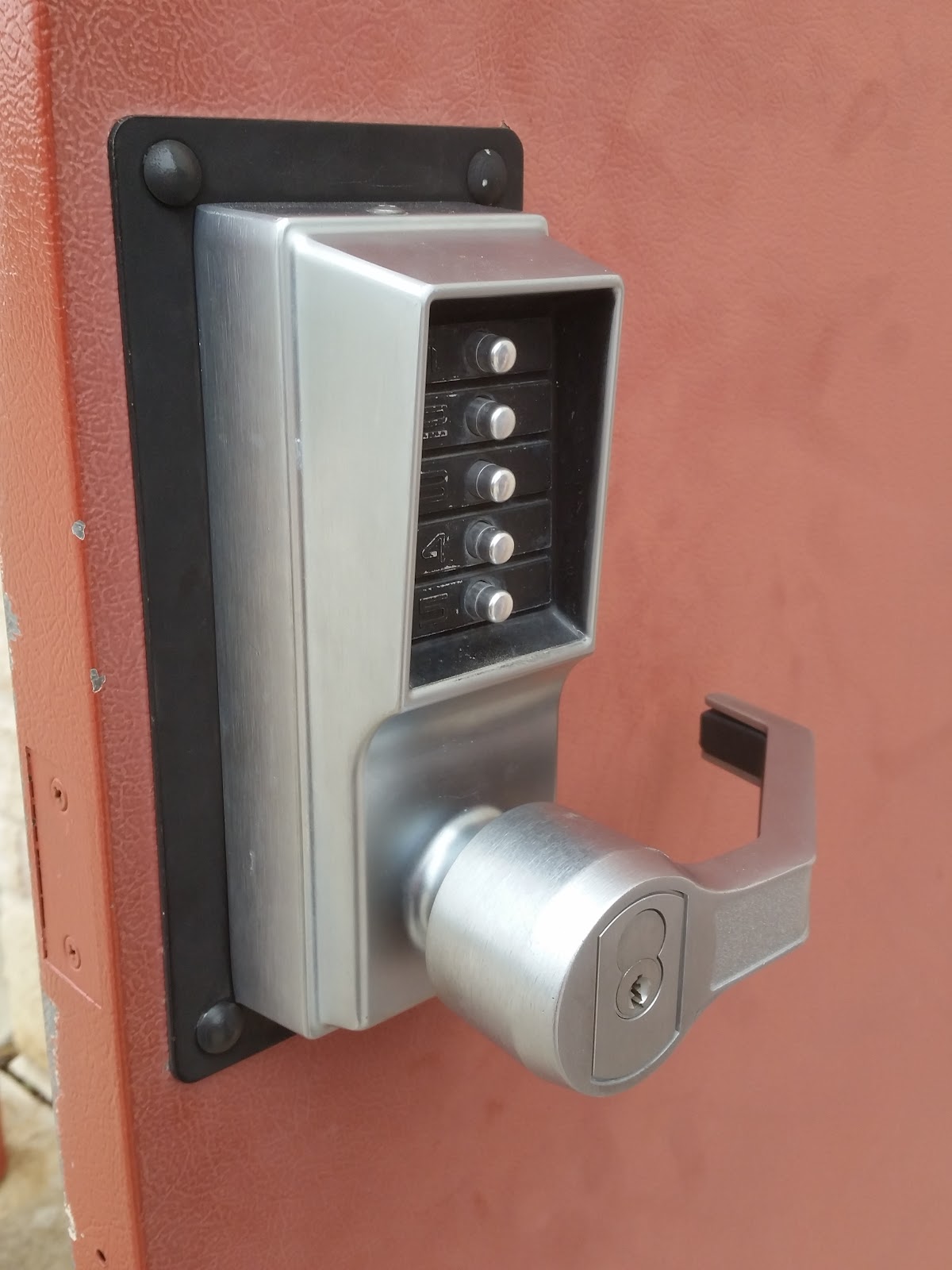 Commercial keypad combination lock installed on a door by Hyder & Son
